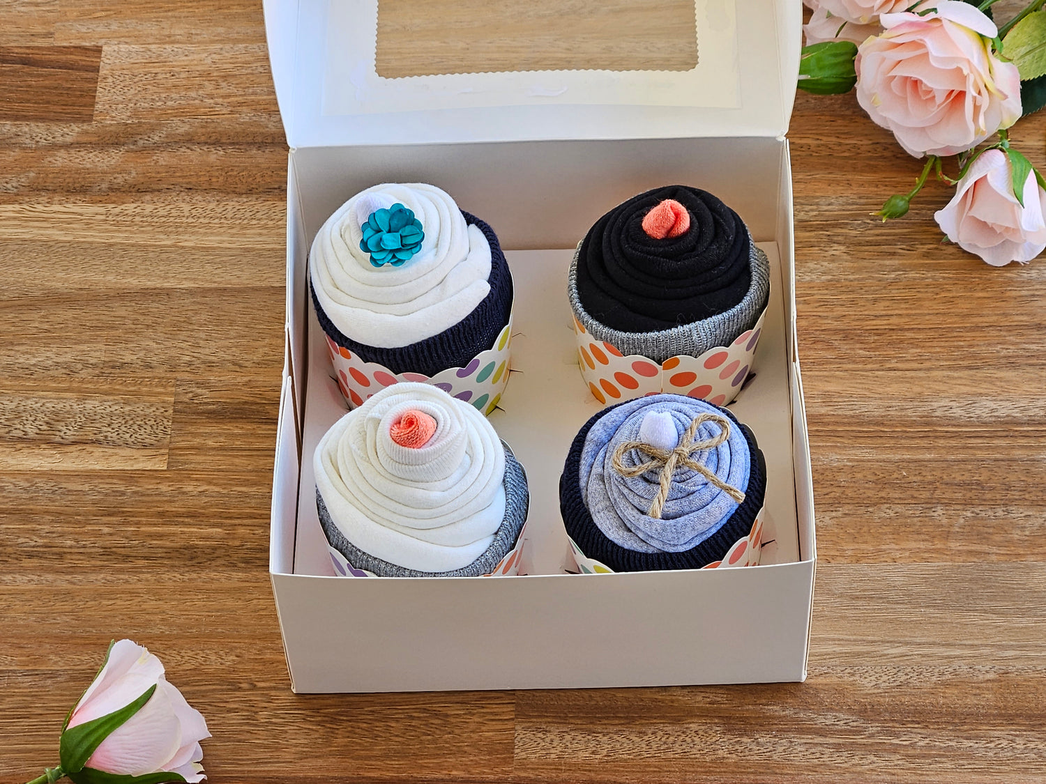 Baby gift box, 4 x Baby rompers, 2 x Pairs of socks made into cupcakes