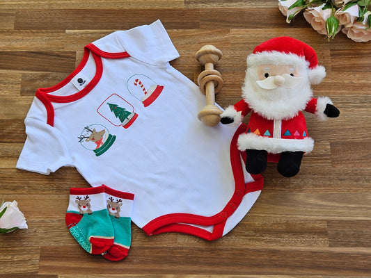 Christmas Gift box includes White romper with red trim, Reindeer socks, Wooden bar toy and a plush Santa