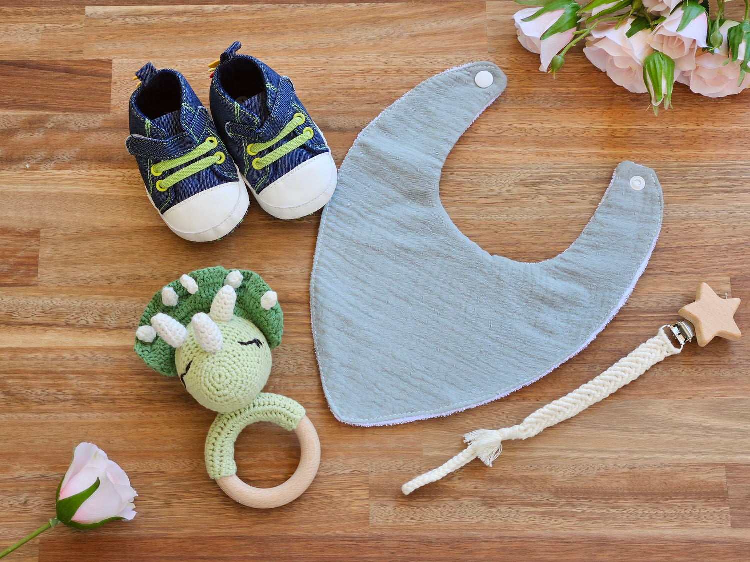 Dinosaur sneaker with triceratops rattle, waterproof bib and macramé pacifier clip