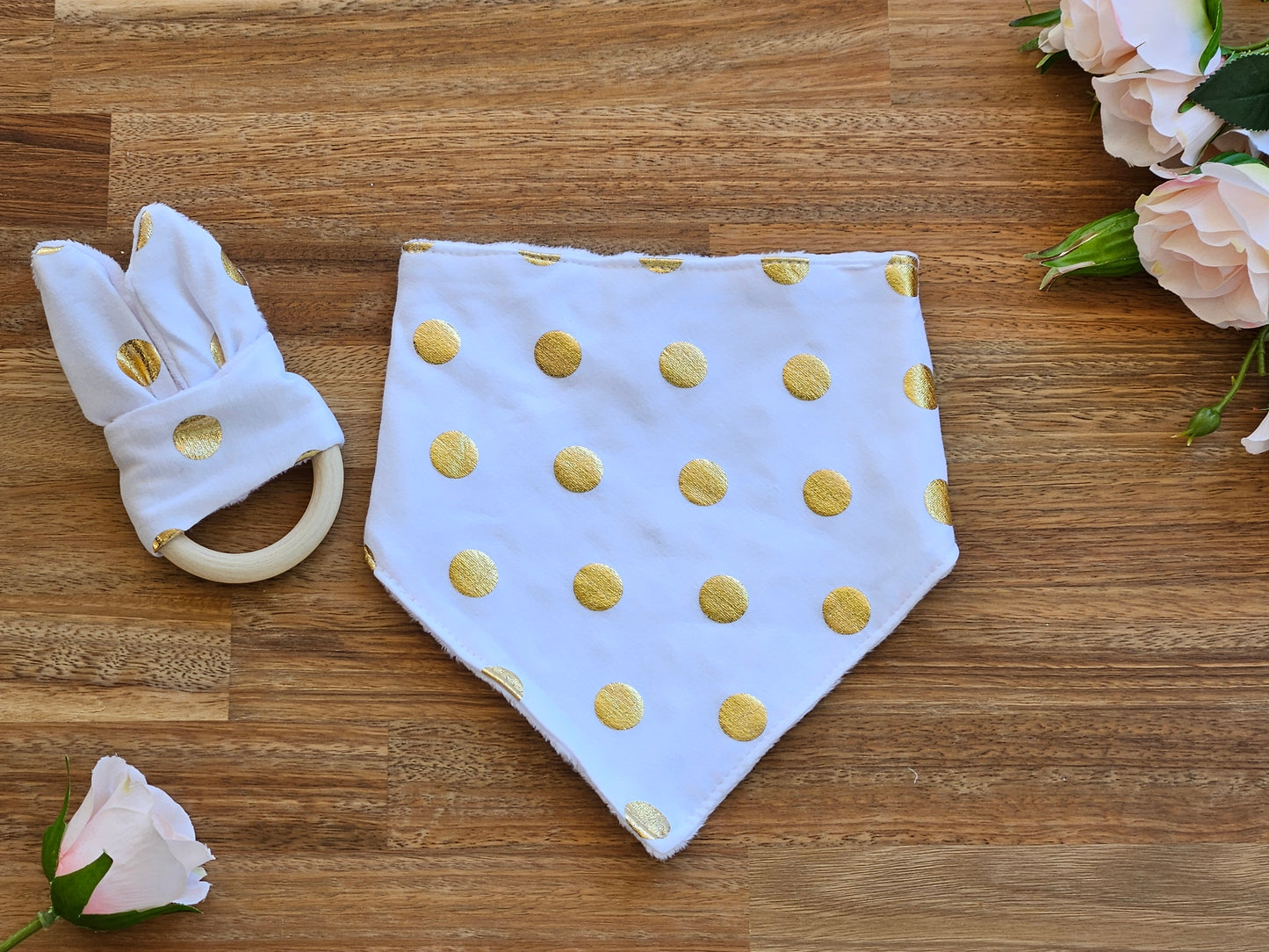 white and gold spotted bandana bib and teether ring toy