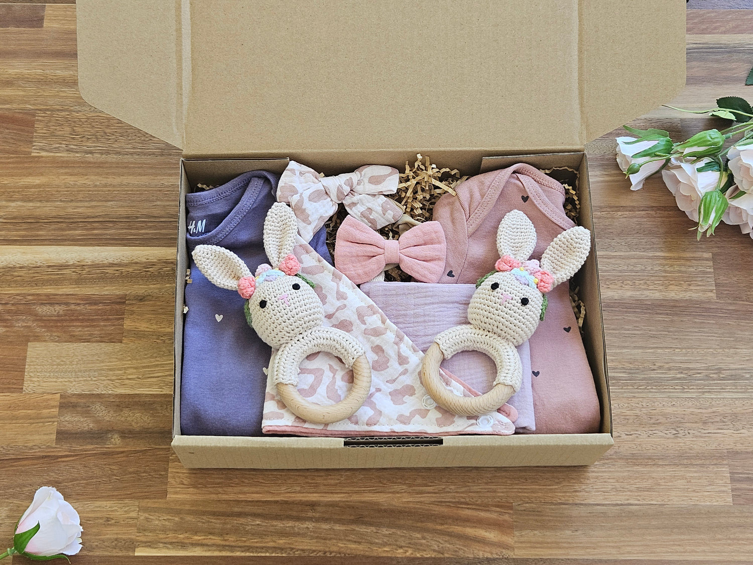 Gift box Includes
2 x  Long sleeve cotton romper size 0
1 x Muslin Drool cloth
1 x Muslin Bandana Bib
2 x Muslin bow headbands
2 x Soft Crochet Flower Girl Rabbit rattle