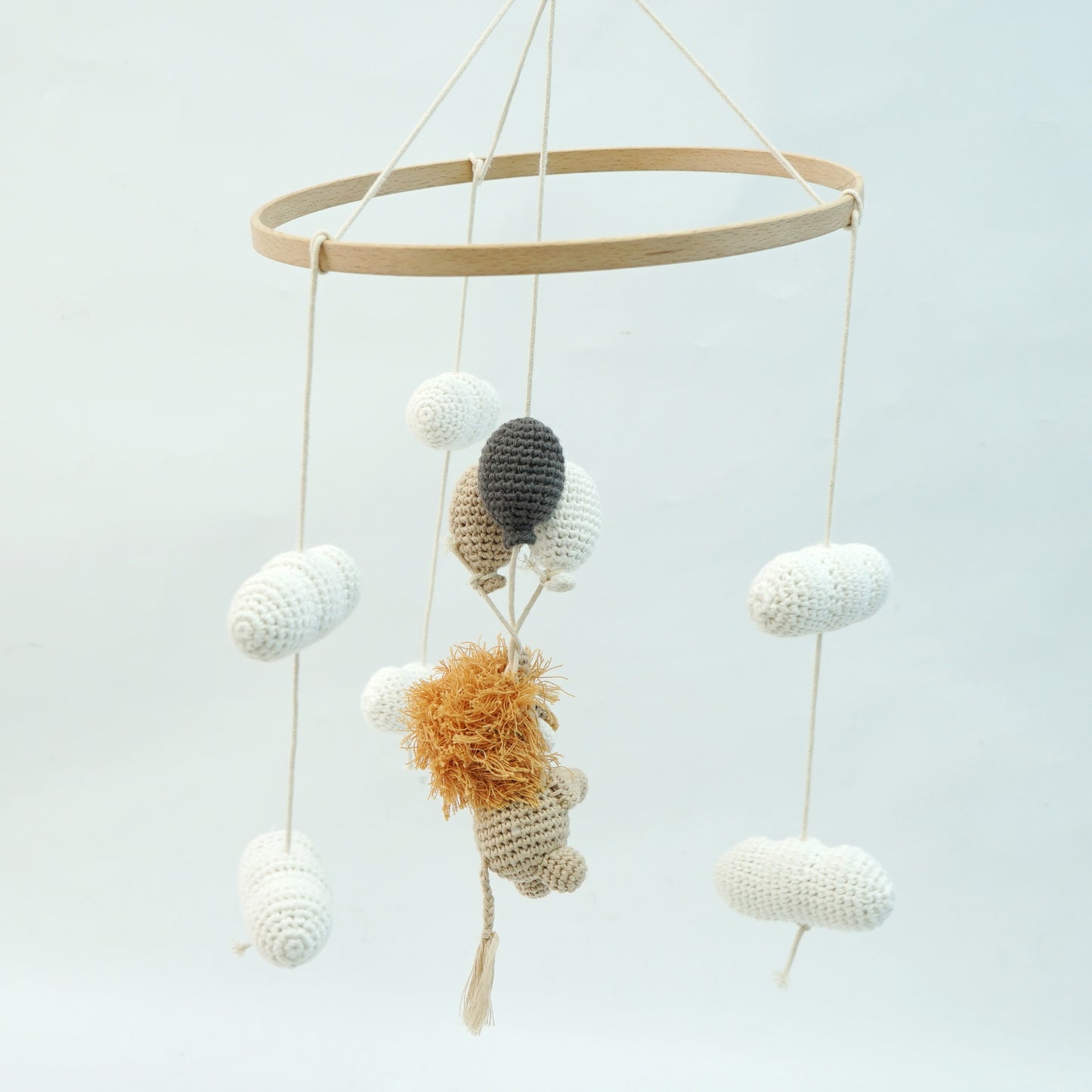 Crocheted Lion hanging mobile with cream clouds and cream, beige and dark grey crocheted balloons