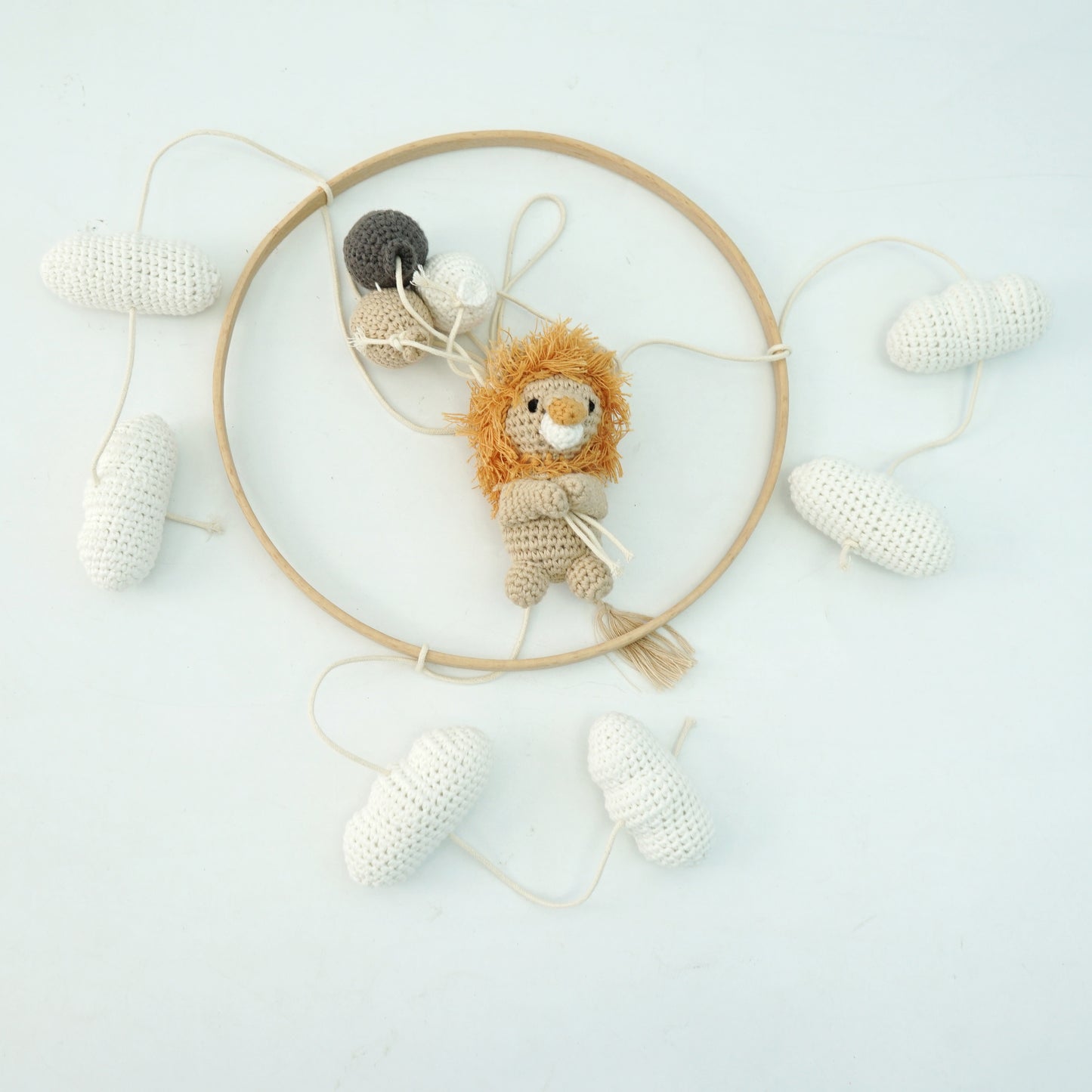 Crocheted Lion hanging mobile with cream clouds and cream, beige and dark grey crocheted balloons