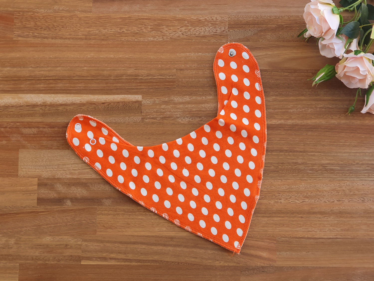 Orange and white spotted Bandana bib