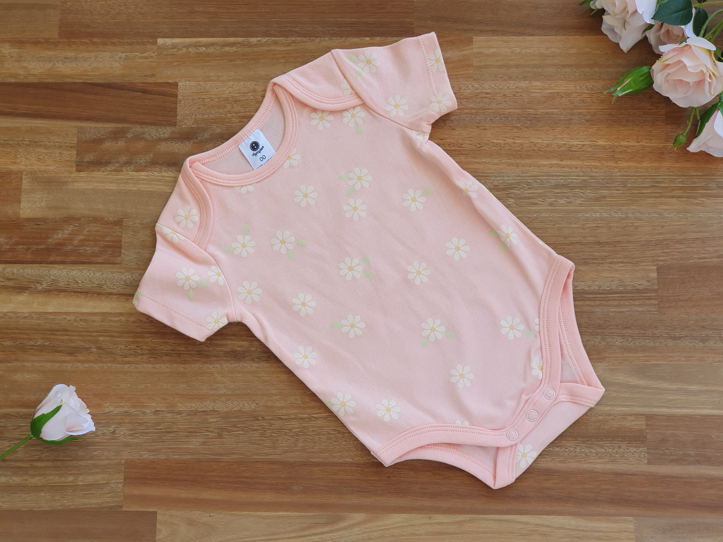 Pink Romper with daisy pattern