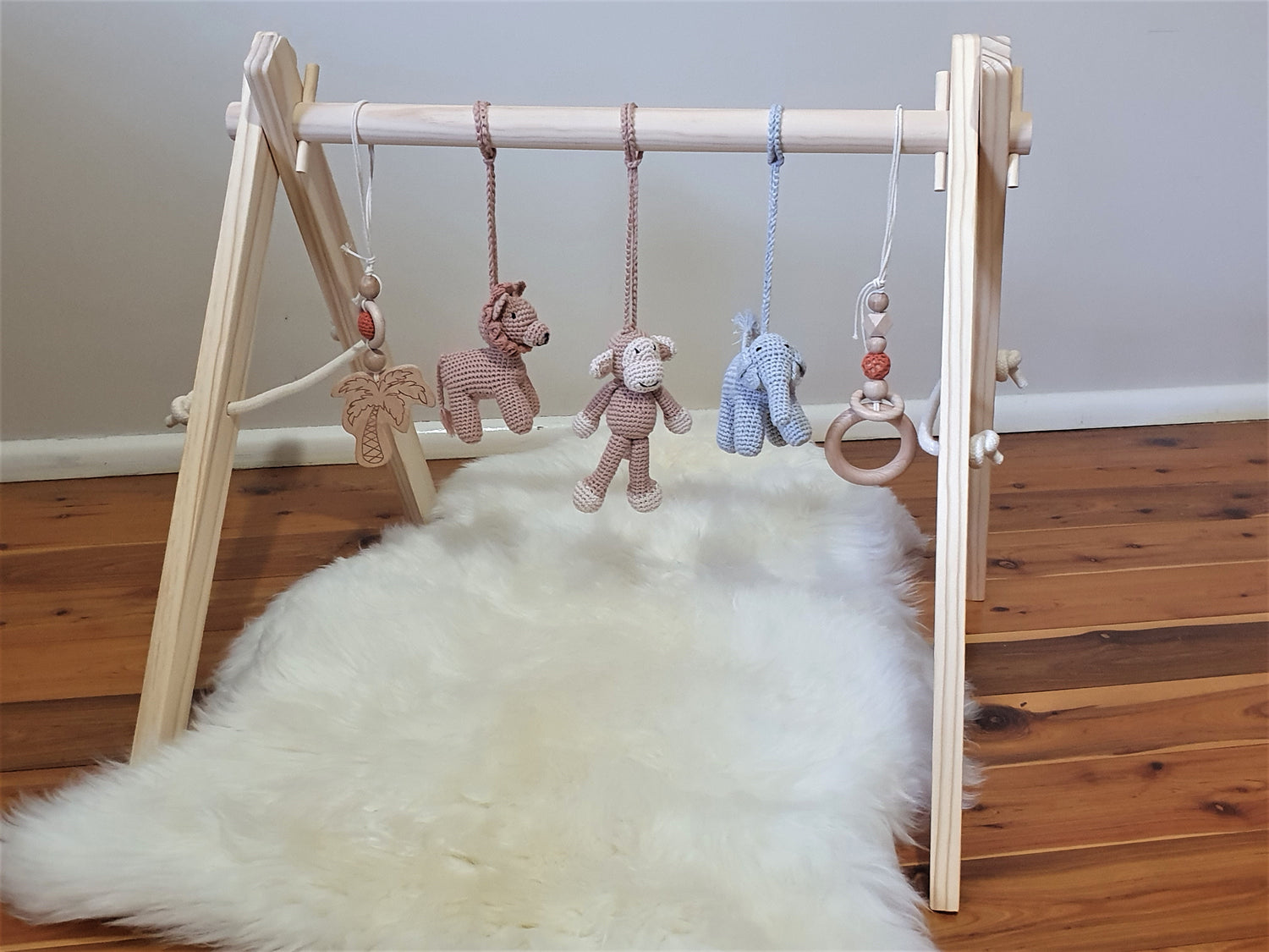 Jungle themed play gym with wooden frame, Crochet Monkey, crochet brown lion, crochet grey elephant, 2 wooden hanging toys