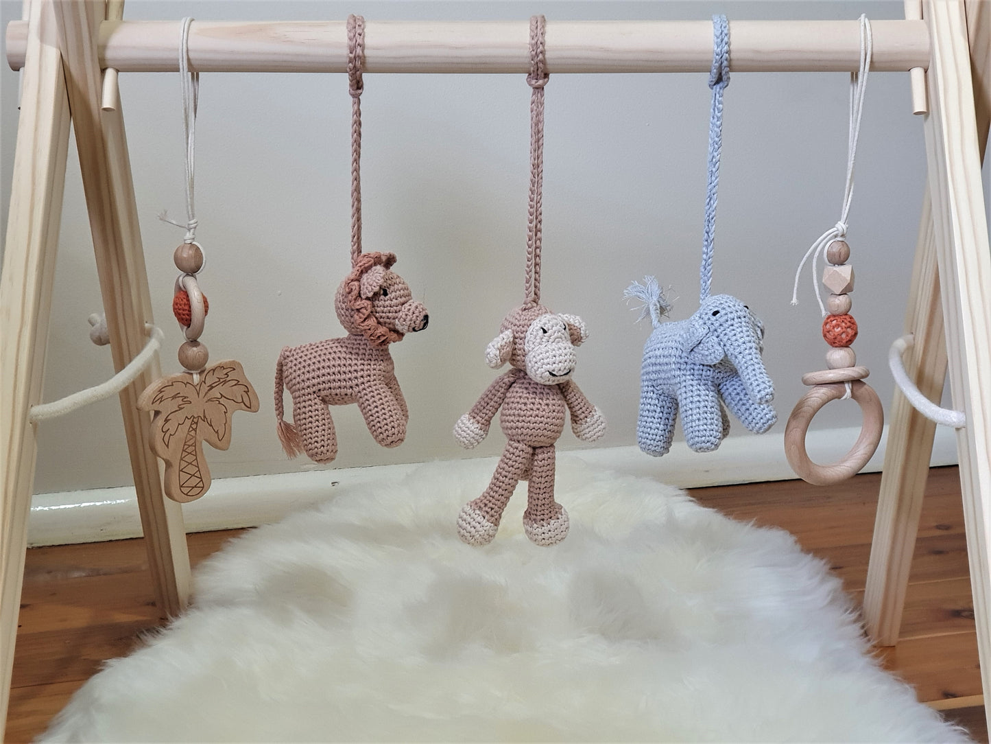 Jungle themed play gym with wooden frame, Crochet Monkey, crochet brown lion, crochet grey elephant, 2 wooden hanging toys